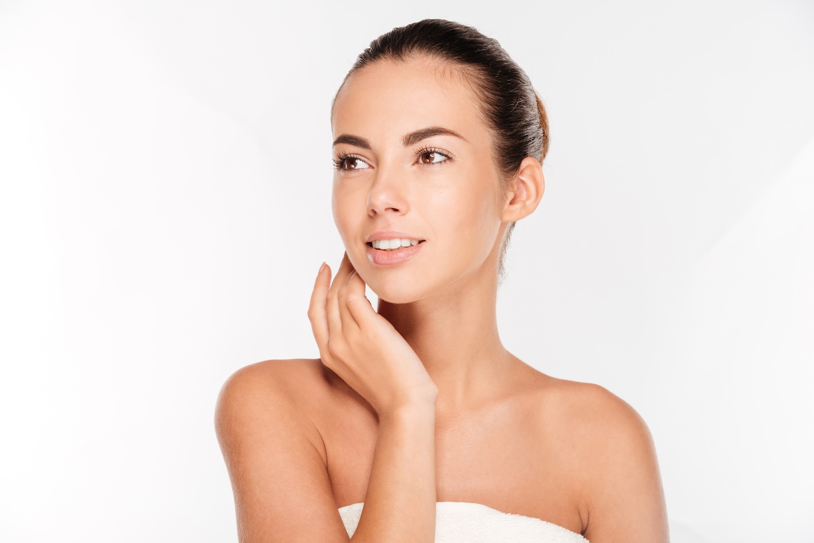 portrait of a woman with fresh skin looking away on a white background SBI 302779109