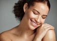 Face, beauty and skin with a model black woman in studio on a gray background kidney and liver health